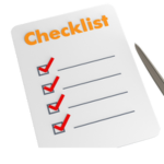 Checklist with checked boxes and a pen.